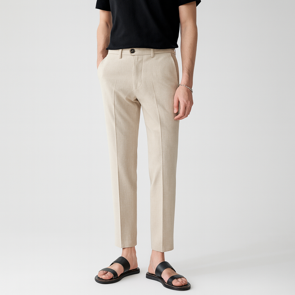 Slim-fit trousers with belt loops, side pockets, and a front crease detail.