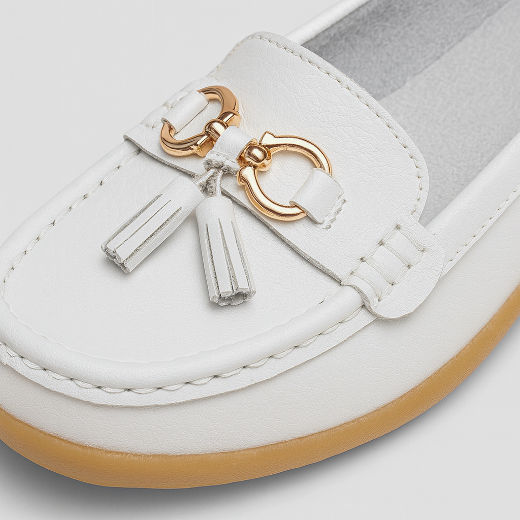 Classic loafers featuring tassel accents, gold hardware detail, and cushioned soles for comfort.