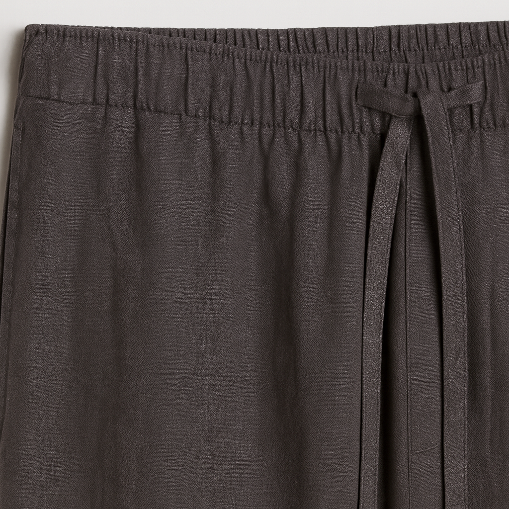 Relaxed-fit pants with an elastic waistband, drawstring tie, and straight legs.