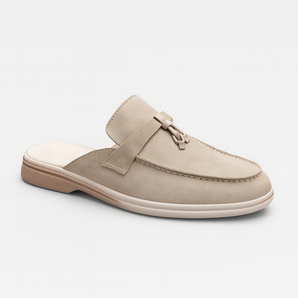 Stylish suede slip-on loafers featuring tassel accents and a low-heel design with contrast soles.