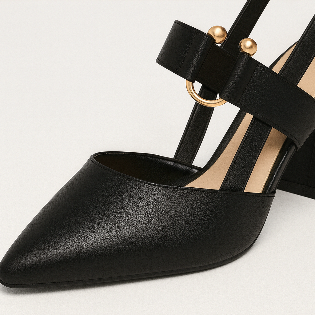 Stylish slingback high heel with a pointed toe, curved block heel, and gold accent detail on the strap.